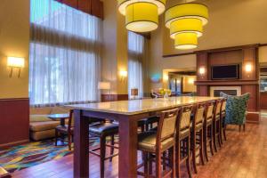 a large dining room with a large table and chairs at Hampton Inn & Suites Ontario in Ontario