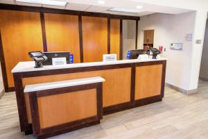 a lobby with a reception desk with two phones at Homewood Suites by Hilton Ontario Rancho Cucamonga in Rancho Cucamonga