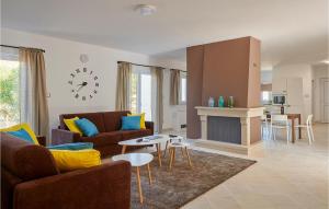 a living room with a couch and a fireplace at Villa 1 Mala Rudina in Rudina