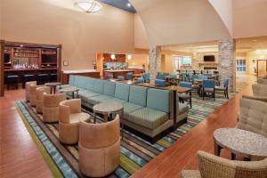 a lobby of a hotel with couches and chairs at Homewood Suites by Hilton Virginia Beach in Virginia Beach