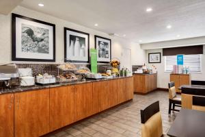 a kitchen with a counter with food on it at Hampton Inn - Portland/Clackamas in Clackamas