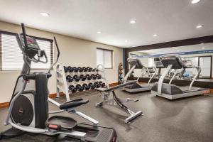 a gym with three exercise bikes and tread machines at Hampton Inn - Portland/Clackamas in Clackamas