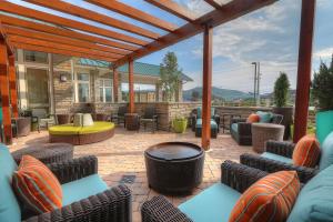 a patio with wicker chairs and a table at Hilton Garden Inn Pigeon Forge in Pigeon Forge