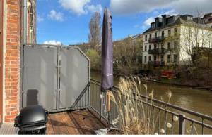 a balcony with a view of a river at Traum Wohnung mit Hauch Venedig/Kanal mit Kajak/Sauna/Fitness in Leipzig