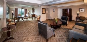 a lobby of a hotel with chairs and tables at DoubleTree Suites by Hilton Hotel Philadelphia West in Plymouth Meeting