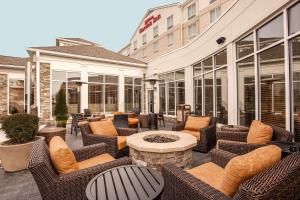 a patio with wicker chairs and a fire pit at Hilton Garden Inn Valley Forge/Oaks in Oaks