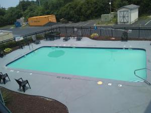 a large blue swimming pool in a parking lot at Clarion Pointe - Greensboro Coliseum Area in Greensboro