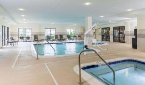 a swimming pool in a building with a swimming pool at Hampton Inn & Suites Philadelphia Montgomeryville in North Wales