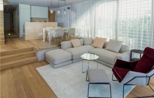 a living room with a couch and a table at Villa Magnolia in Petrcane