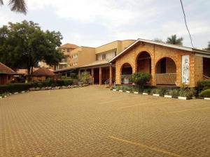 a large parking lot in front of a building at HOIMA KOLPING HOTEL in Hoima