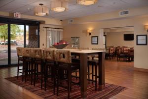 a dining room with a table and some chairs at Hampton Inn Phoenix/Anthem in Anthem