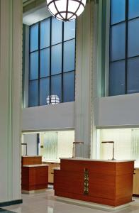 a row of desks in a large room with windows at Hilton Garden Inn Phoenix Downtown in Phoenix