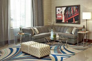 a living room with a couch and a rug at Hilton Garden Inn Phoenix Downtown in Phoenix