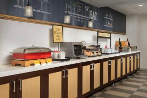 a kitchen with a counter with a bunch of food at Hampton Inn Pittsburgh-Monroeville in Monroeville