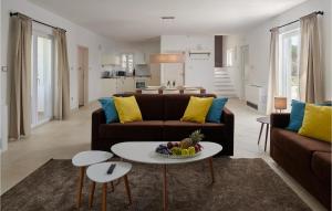 a living room with a couch and a table at Villa 6 Mala Rudina in Rudina