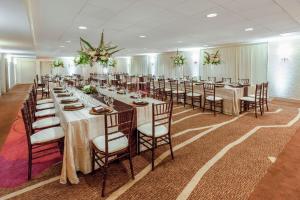 a banquet hall with long tables and chairs at Hilton Garden Inn Pittsburgh University Place in Pittsburgh