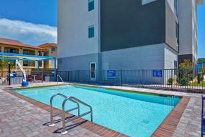 a swimming pool in front of a building at Tru By Hilton Fort Walton Beach, Fl in Fort Walton Beach