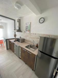 Kuchyňa alebo kuchynka v ubytovaní Apartman Nadia Seaview
