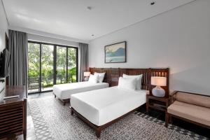Ein Bett oder Betten in einem Zimmer der Unterkunft Coco Island Resort Ninh Binh