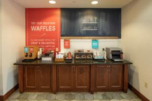 a counter in a coffee shop with a microwave at Hampton Inn Presque Isle in Presque Isle