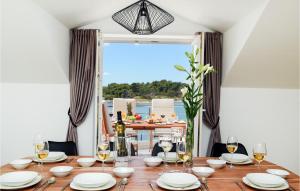 a dining room table with a view of the ocean at Villa Am 2 in Nin