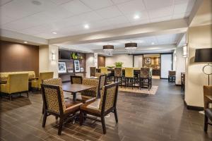 a dining room with a table and chairs at Hampton Inn Dover in Dover