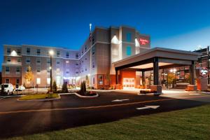 a hotel building with a parking lot in front of it at Hampton Inn Lewiston-Auburn in Lewiston