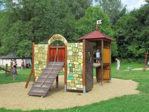 a playground with a slide and a play structure at Ferienwohnung-Heidi in Kirschau