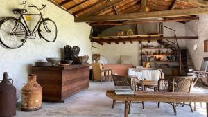 a living room with a bike hanging on the wall at Casa de Vilar de Rei, férias em família com piscina in Ponte de Lima
