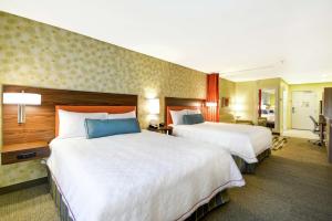 Home2 Suites By Hilton Rapid City客房内的一张或多张床位