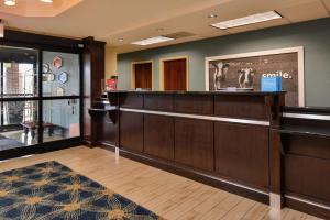 a barber shop with a reception desk in a room at Hampton Inn Raleigh Clayton I-40 Garner in Garner