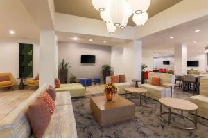 a lobby with couches and chairs and a table at Hilton Garden Inn Raleigh-Durham/Research Triangle Park in Durham