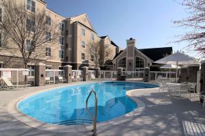 a large swimming pool in front of a building at Homewood Suites Durham-Chapel Hill I-40 in Durham