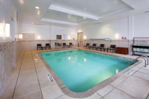 a large swimming pool in a hotel room at Hilton Garden Inn Raleigh Cary in Cary