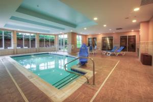 a swimming pool in a hotel room with a pool at Hilton Garden Inn Durham Southpoint in Durham