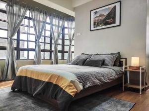 a bedroom with a bed and a large window at 7pax-Genting Premium Outlet LARGEST Family Retro English Cottage - F-Parking, Self C-In in Genting Highlands