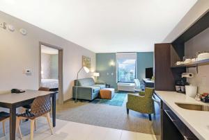 a room with a kitchen and a living room at Home2 Suites By Hilton Raleigh Durham Airport RTP in Durham