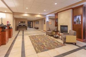 a lobby of a hospital with chairs and a fireplace at Hampton Inn Rock Springs in Rock Springs