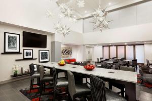 a dining room with a large table and chairs at Hampton Inn and Suites Roanoke Airport/Valley View Mall in Roanoke