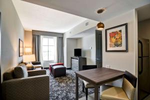 a living room with a couch and a table at Homewood Suites by Hilton Christiansburg in Christiansburg