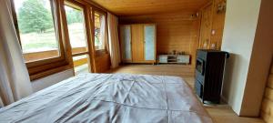 a bedroom with a bed and a television in a cabin at 650m n.p.m. in Zawoja
