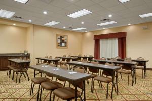 a classroom with tables and chairs in a room at Homewood Suites by Hilton Rochester - Victor in Victor