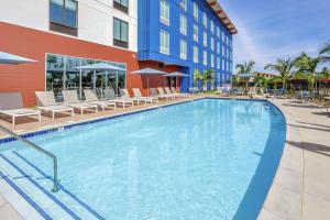 a large swimming pool in front of a hotel at Hampton Inn & Suites San Diego Airport Liberty Station in San Diego