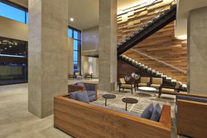 a lobby of a building with a staircase at Hilton San Diego Mission Valley in San Diego