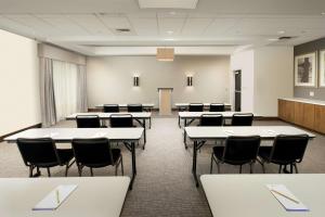 a classroom with tables and chairs in a room at Hilton Garden Inn San Antonio Airport South in San Antonio +26 photos