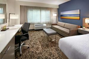 a hotel room with a bed and a couch at Hilton Garden Inn San Diego Mission Valley/Stadium in San Diego +23 photos