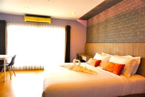 Nest n Rest Hotel客房内的一张或多张床位