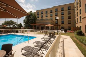 a pool at a hotel with chairs and a table at Homewood Suites by Hilton San Antonio North in San Antonio
