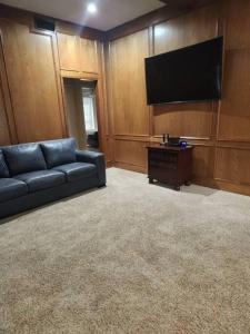 a living room with a couch and a flat screen tv at Terry Kuhlman in San Angelo