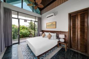 Ein Bett oder Betten in einem Zimmer der Unterkunft Coco Island Resort Ninh Binh